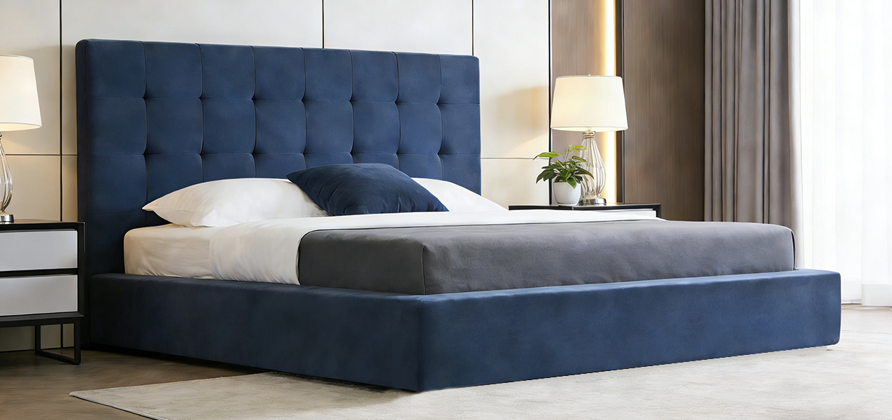 Wholesale Compressed Foam Bed Frame in a modern bedroom setting featuring a tufted navy blue headboard and high-resilience foam wrap