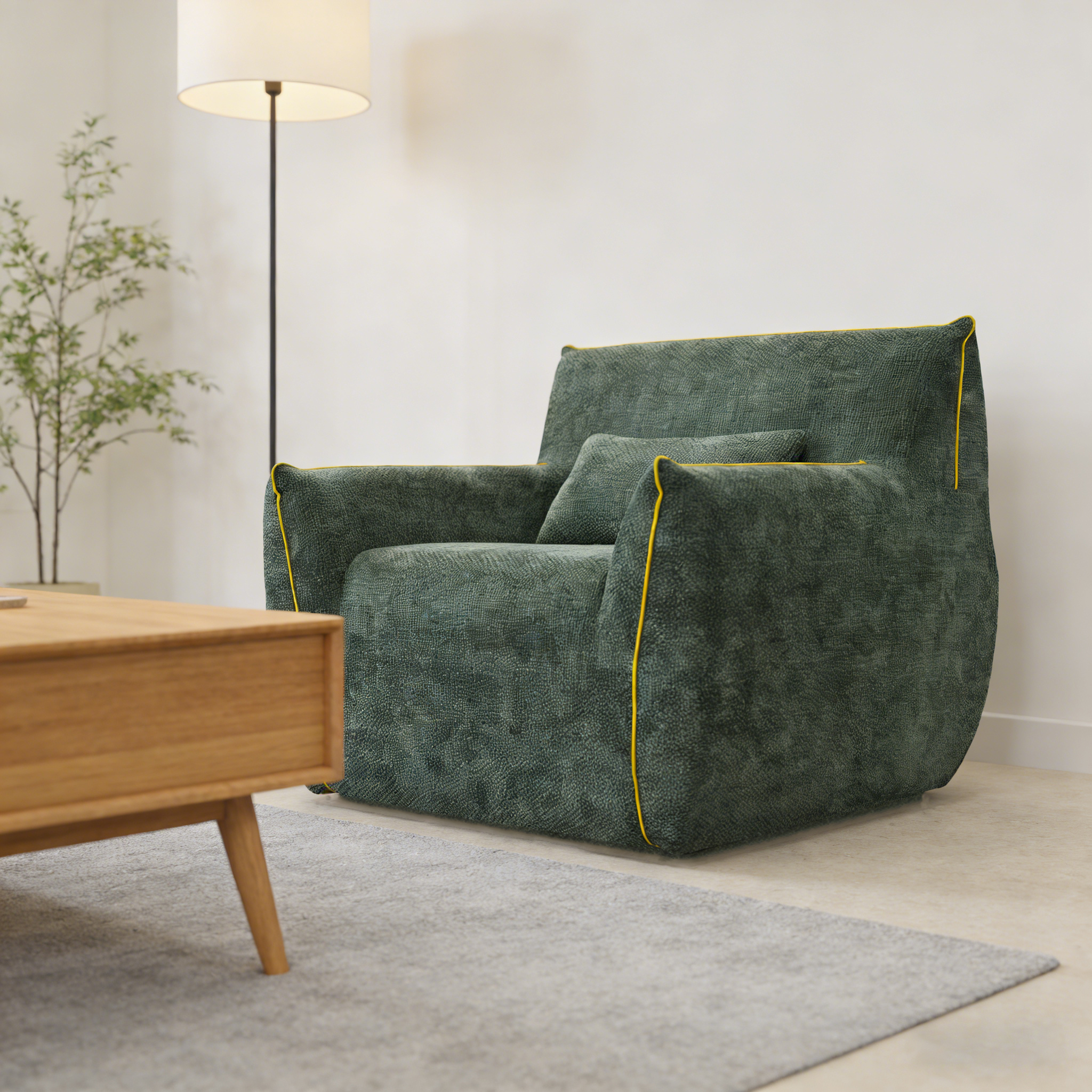Dark green bean bag style lounge chair in a modern living room with a floor lamp and rug.