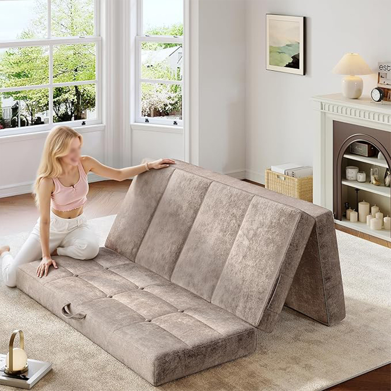 User demonstrating the easy folding mechanism of the modular foam sofa bed for quick room transition