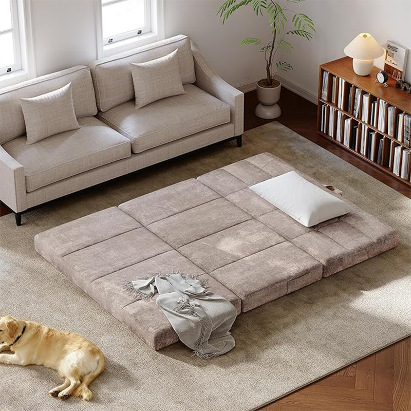 Full-size tri-fold memory foam mattress laid out in a modern living room setting, ideal for apartment living or guest rooms