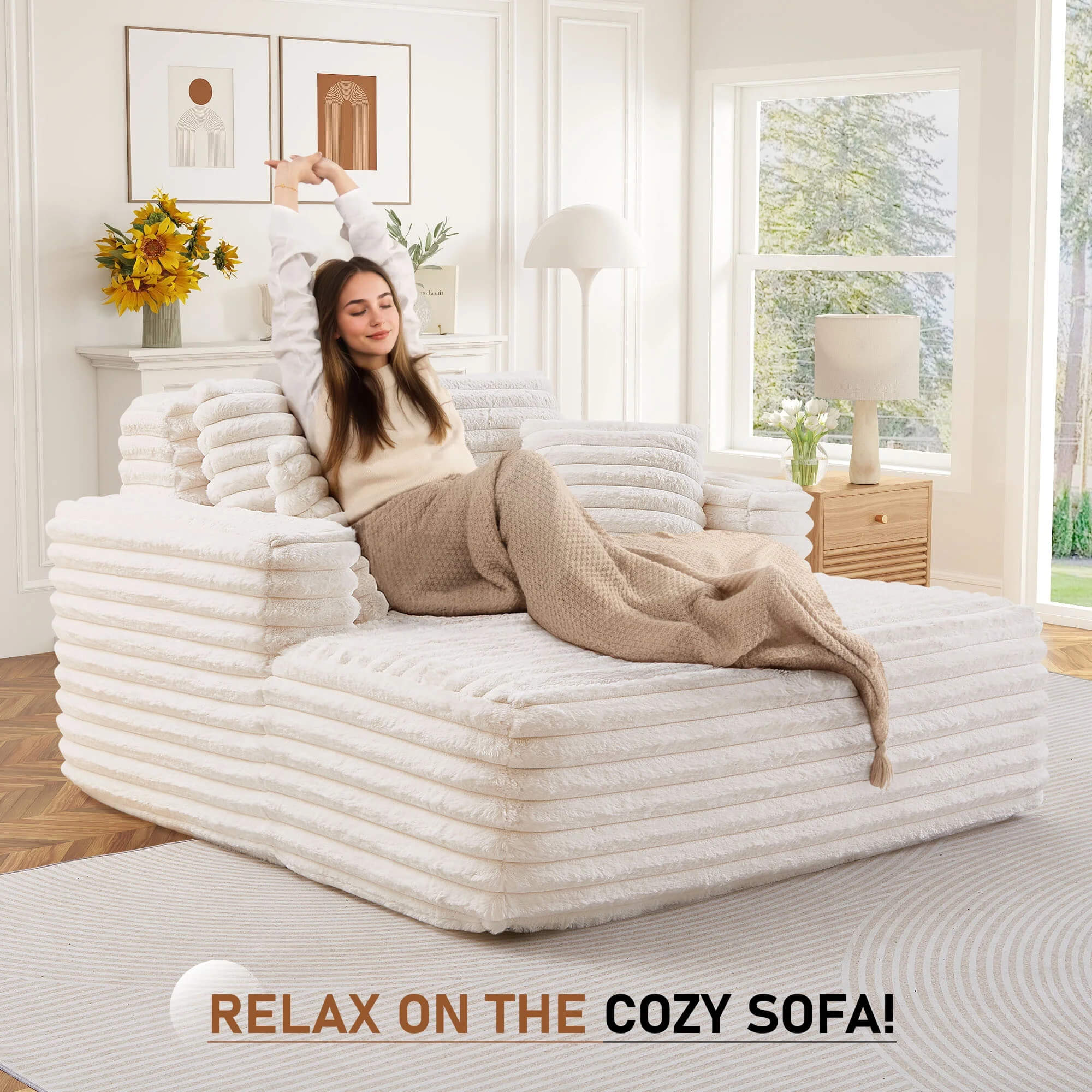 Woman relaxing on a cozy white plush lazy sofa in a bright, modern interior setting