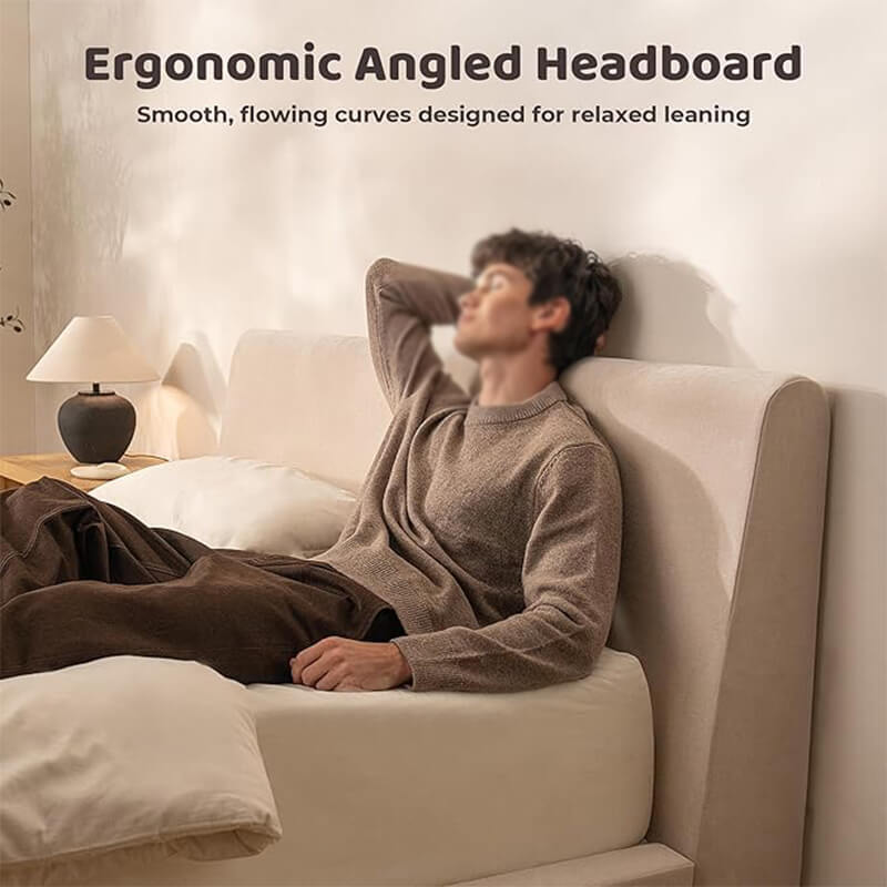 Person leaning against the ergonomic angled headboard of an MX DREAM upholstered bed for relaxation