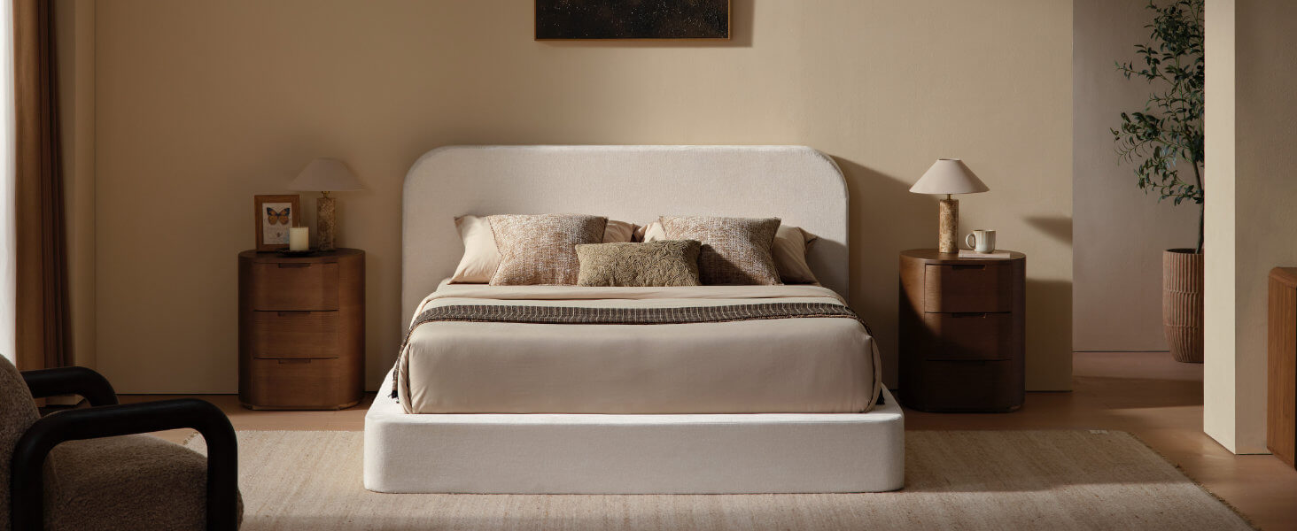 Front view of the elegant MX DREAM fabric bed frame in a contemporary bedroom
